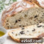 Close up of the sliced no-knead olive bread.