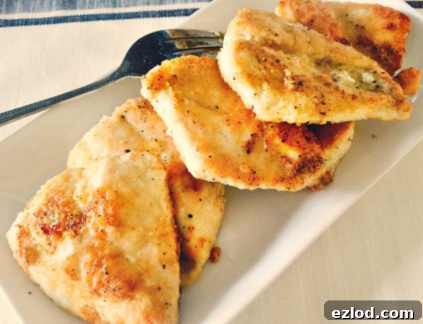 lemon-chicken simmering in a pan