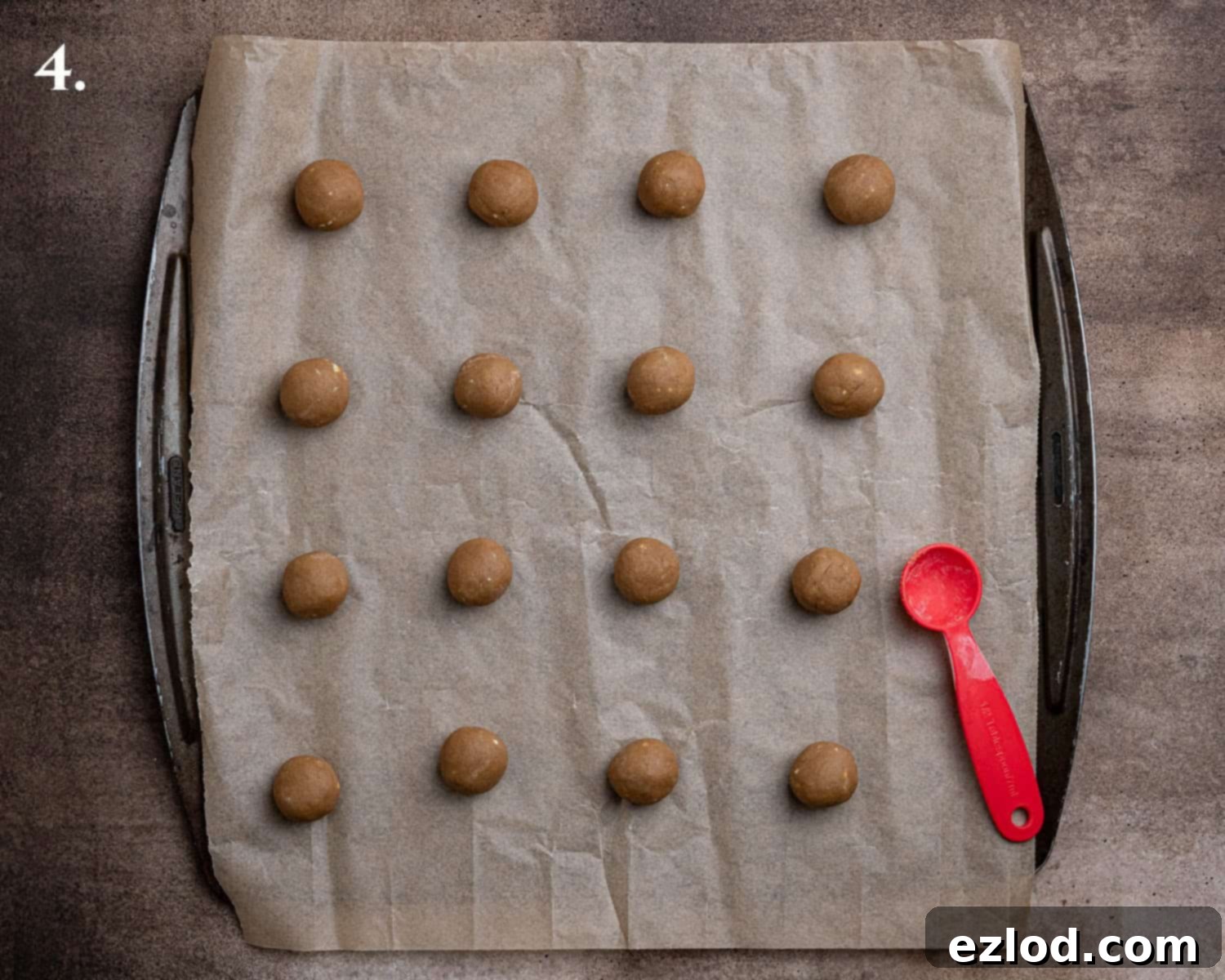 Step 4: The perfectly shaped vegan coffee biscuit dough balls are neatly arranged on a baking sheet, ready for the oven.