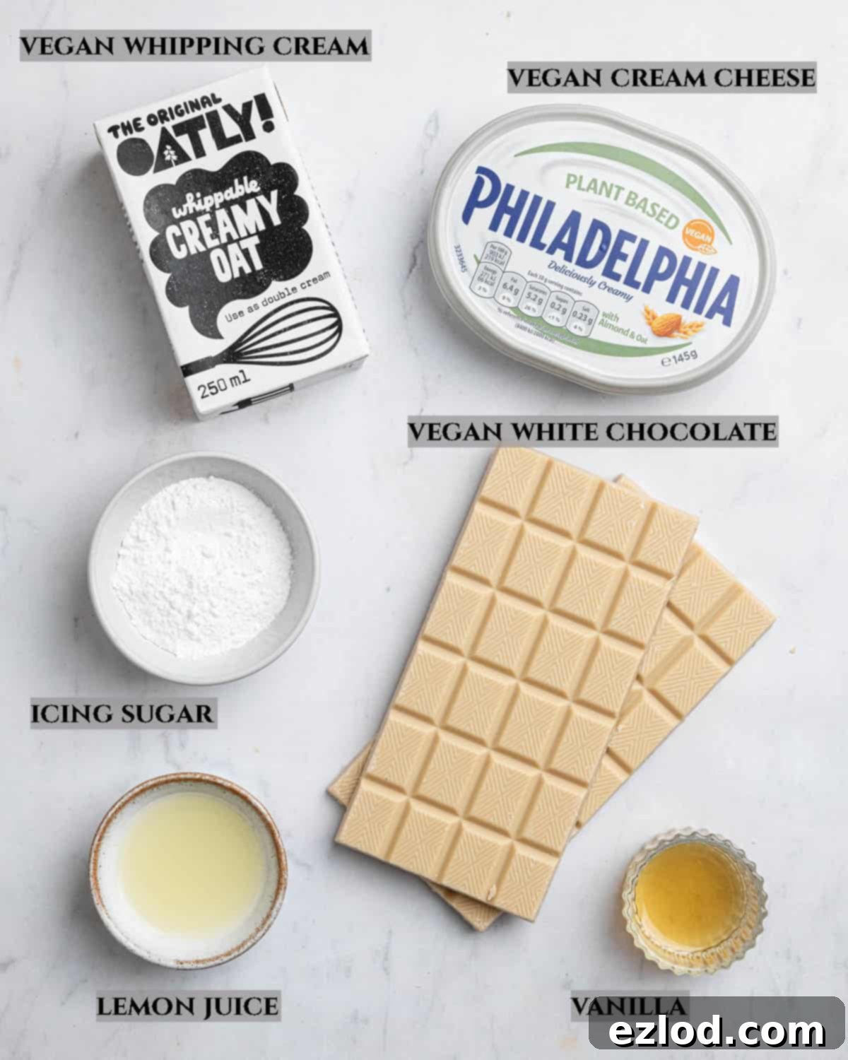 A labelled photo of the ingredients needed to make vegan white chocolate cheesecake.