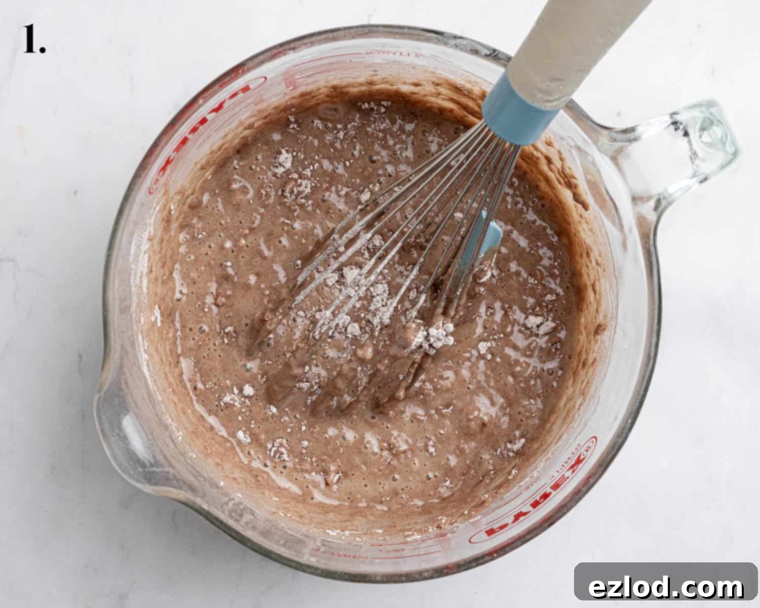 Step 1, the partially mixed batter in a bowl.