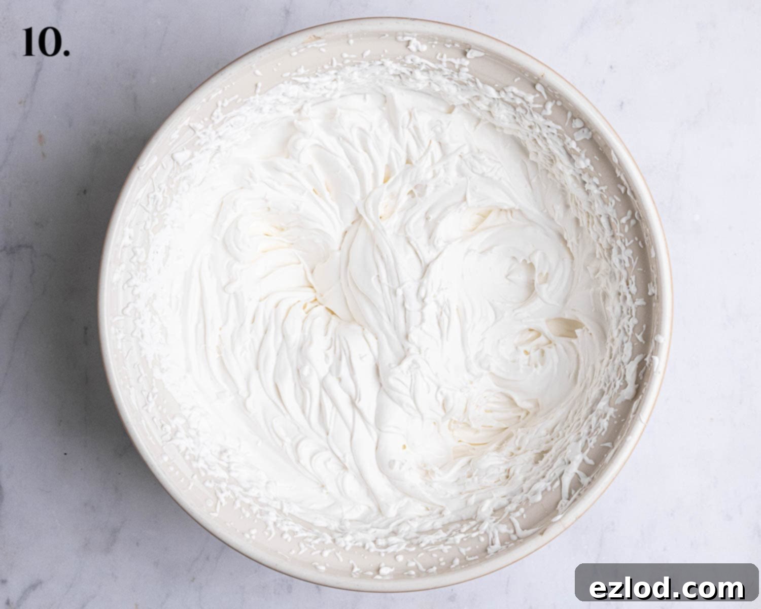 Homemade Vegan Semlor 14 Step 10, the whipped cream in a bowl.