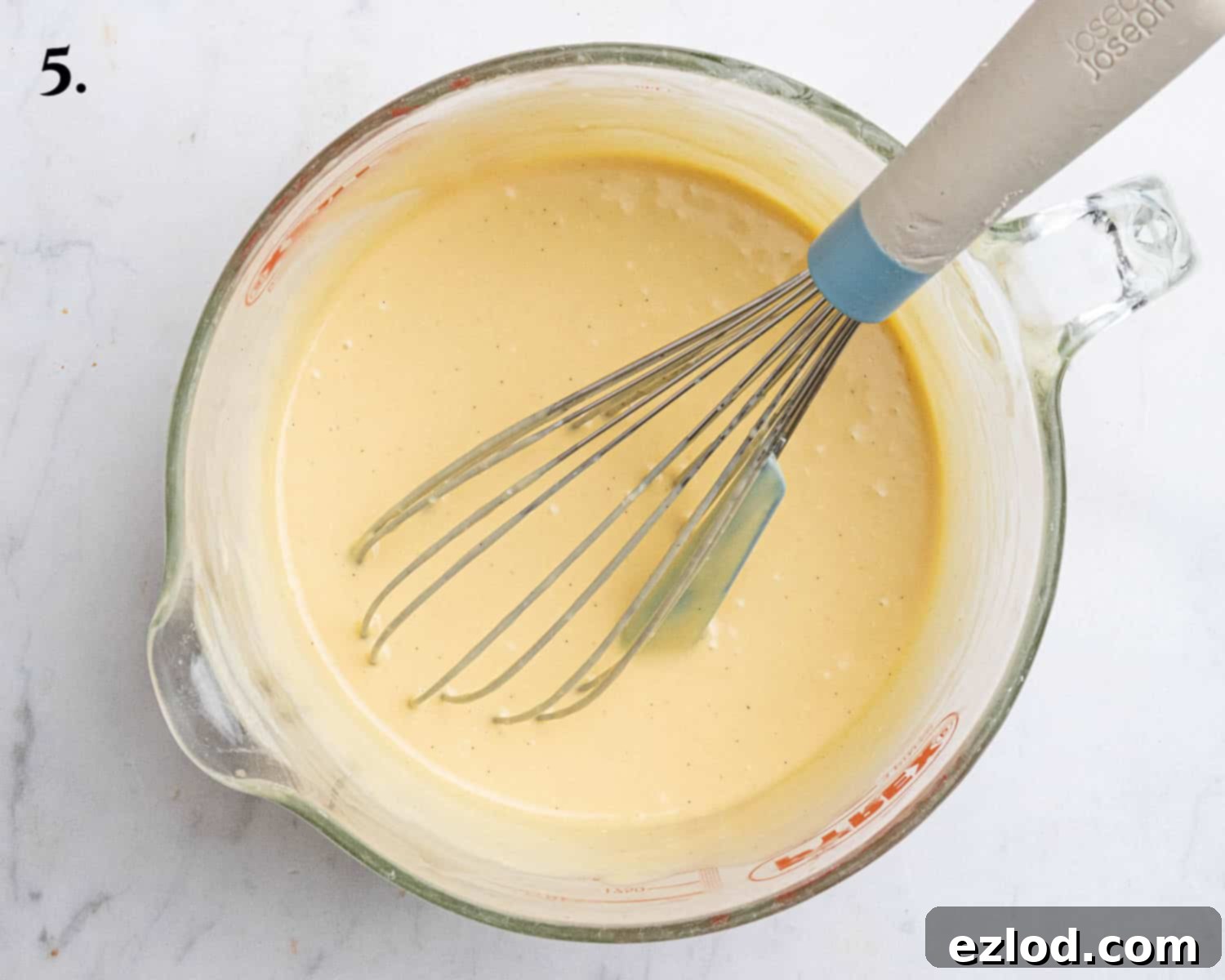 Step 5: The passion fruit mixture, now smoothly combined with vegan cream cheese, lime juice, and vanilla extract.