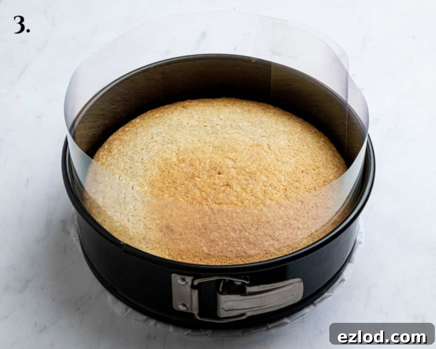 Step 3, the cooled cake in the acetate lined tin.