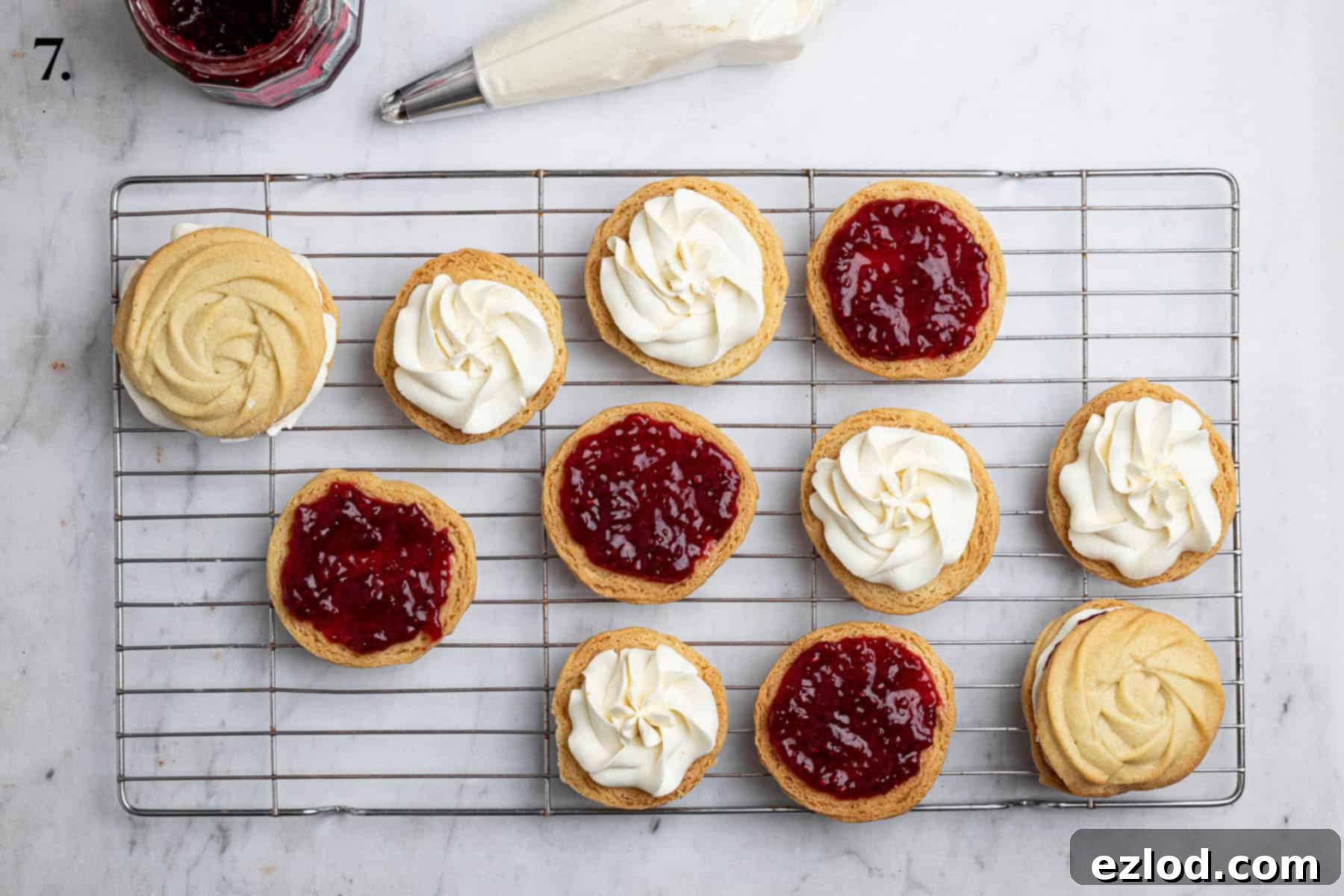 Dairy-Free Viennese Delights 11 Step 7 in making vegan Viennese whirls: The final assembly of the biscuits, with jam and buttercream being added before sandwiching.