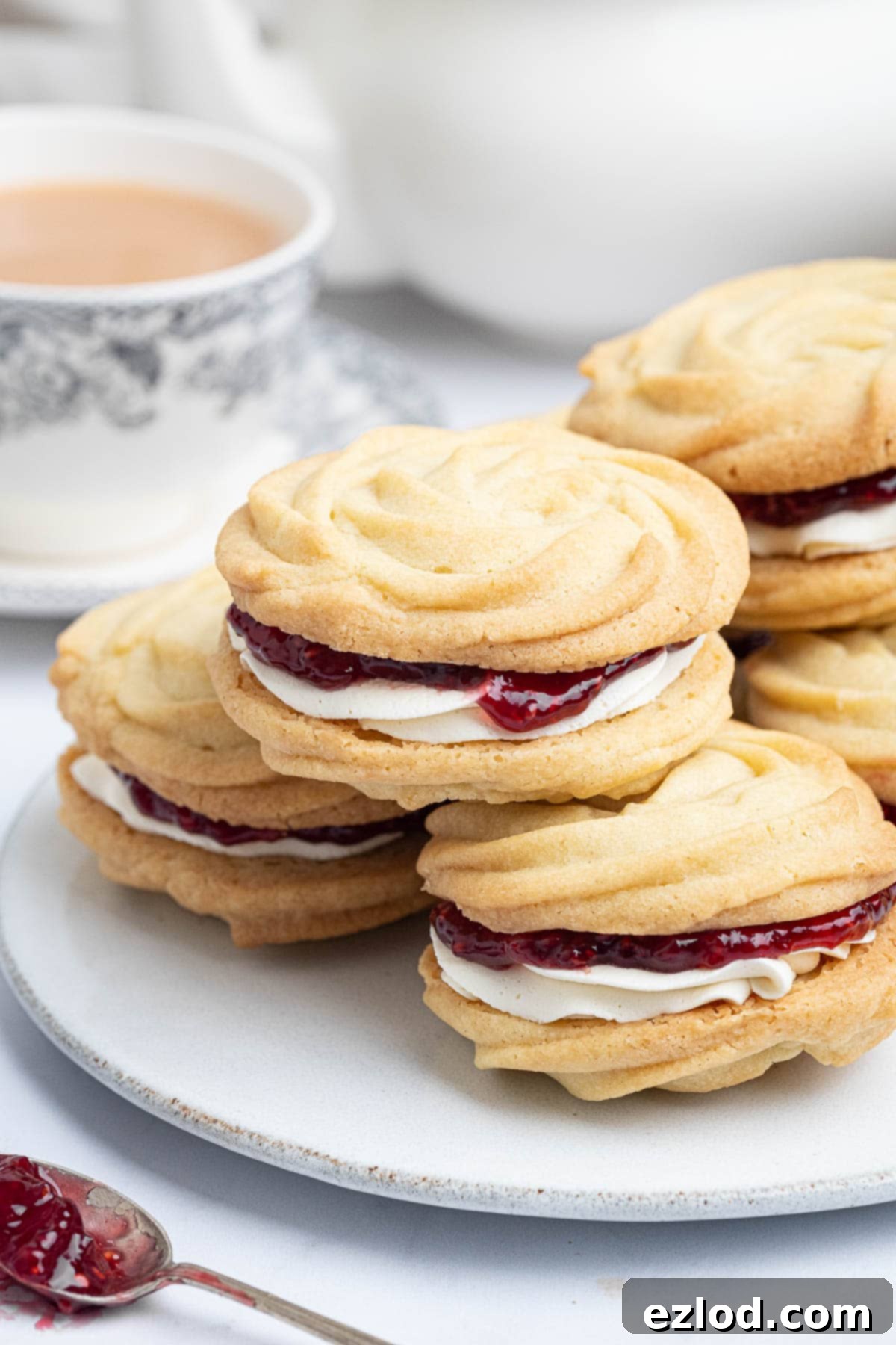 Dairy-Free Viennese Delights 13 Close up of a plate of vegan Viennese whirls, highlighting the delicate texture and inviting filling.