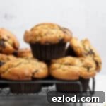 A stack of vegan peanut butter muffins on a wire cooling rack.
