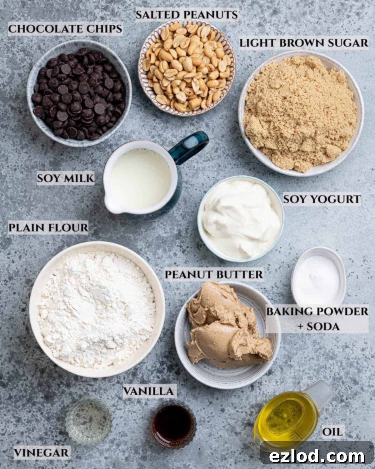A labelled photo of the ingredients needed to make vegan peanut butter muffins.