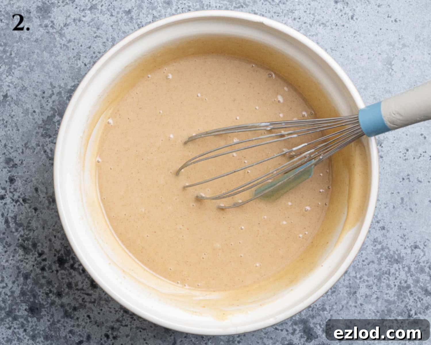 Step 2, the combined wet ingredients in a bowl.