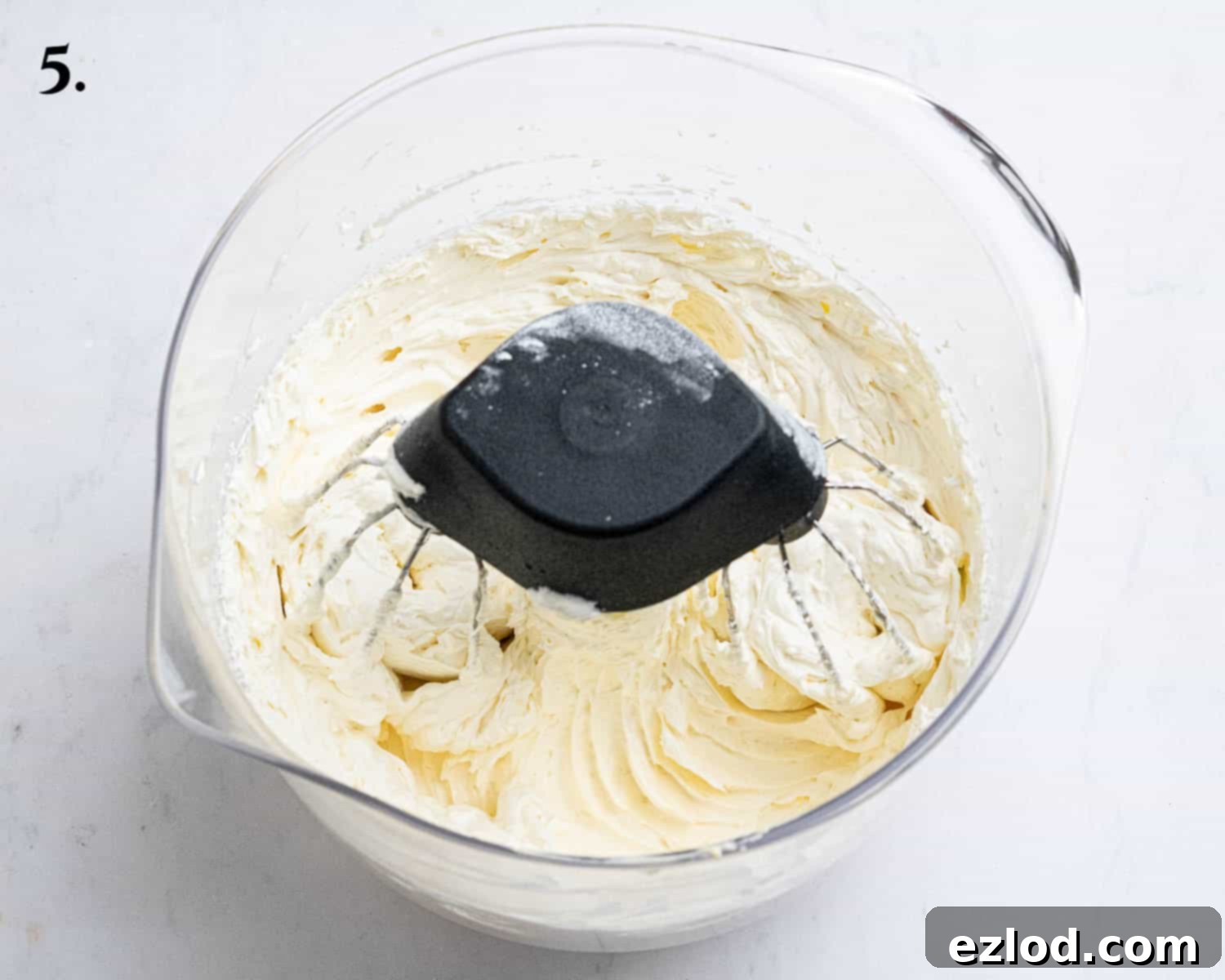 Step 5: Fluffy and perfectly whipped lemon buttercream in a stand mixer bowl, ready for frosting.