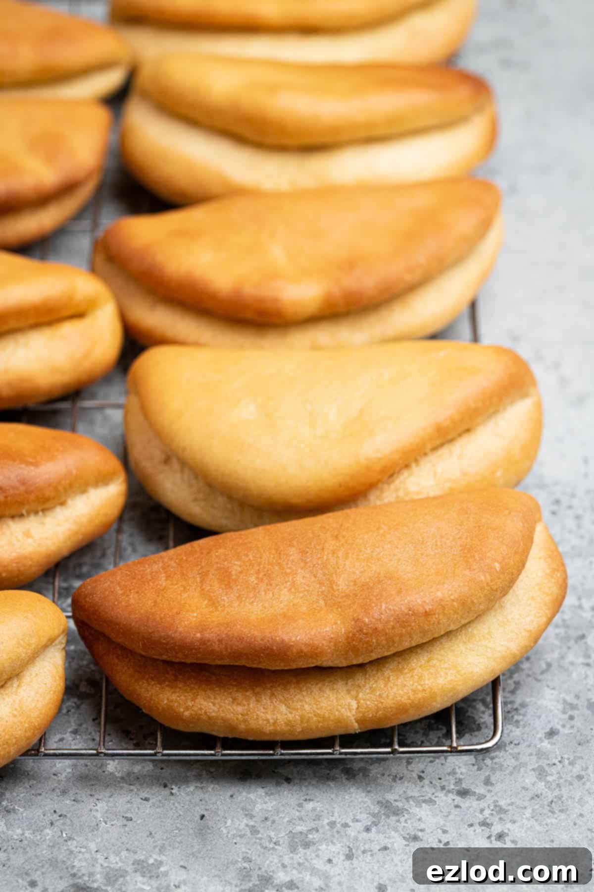 Close up of vegan coco bread on a wire cooling rack.