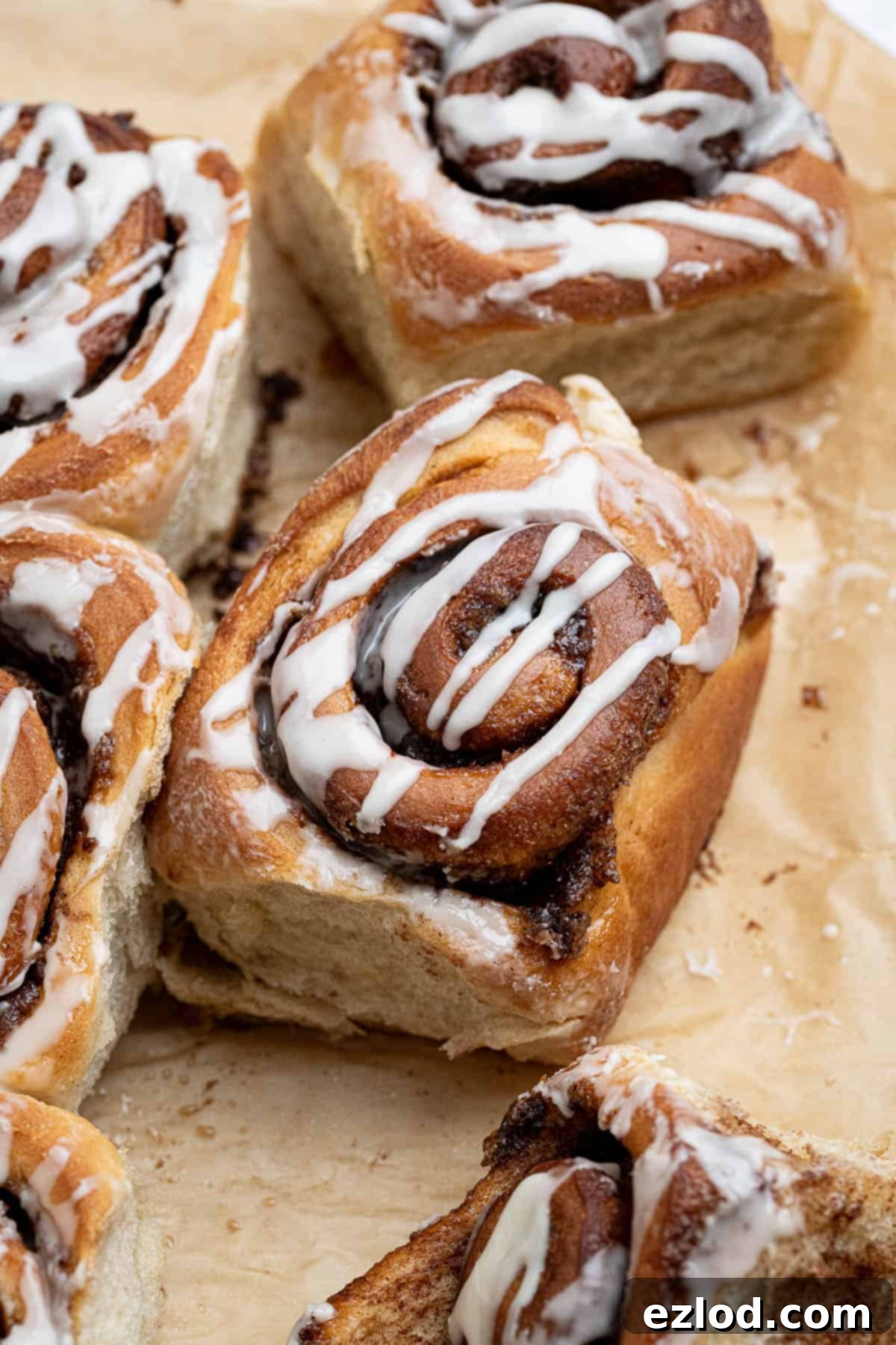 Olive oil cinnamon rolls on brown baking paper.