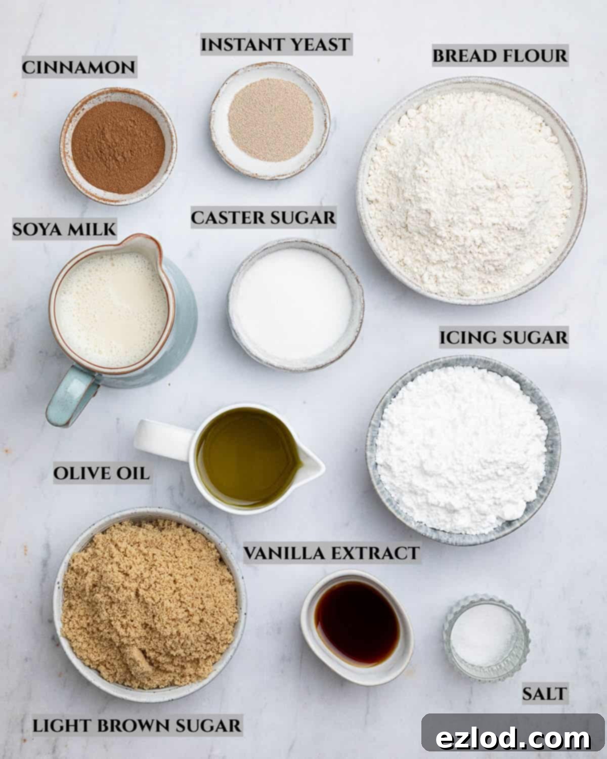 A labelled photo of the ingredients needed to make vegan olive oil cinnamon rolls.