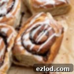 Olive oil cinnamon rolls on brown baking paper.