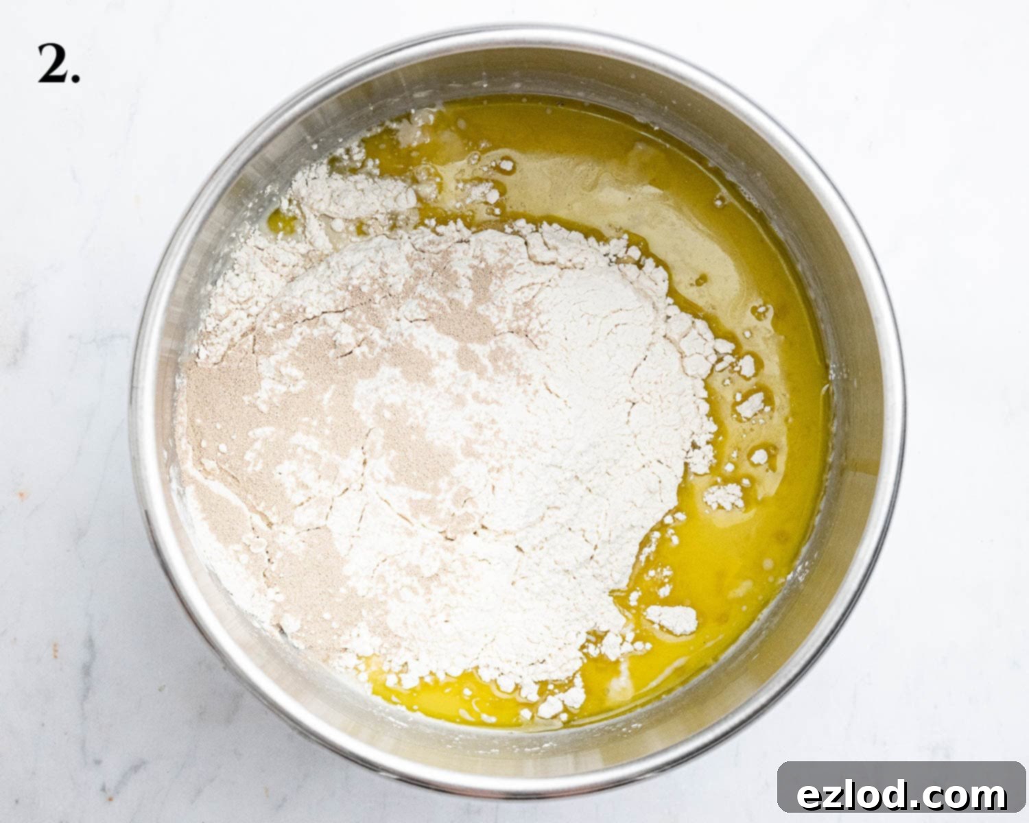 Step 2, the ingredients in the bowl of a stand mixer.
