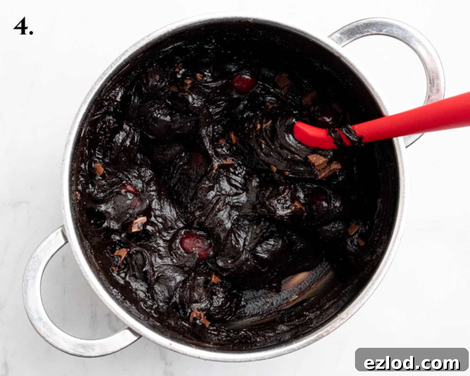 Step 4, the brownie batter with cherries and chocolate chips folded in.