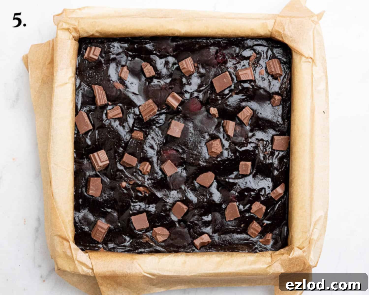 Step 5, the brownie batter spread evenly in the prepared tin.