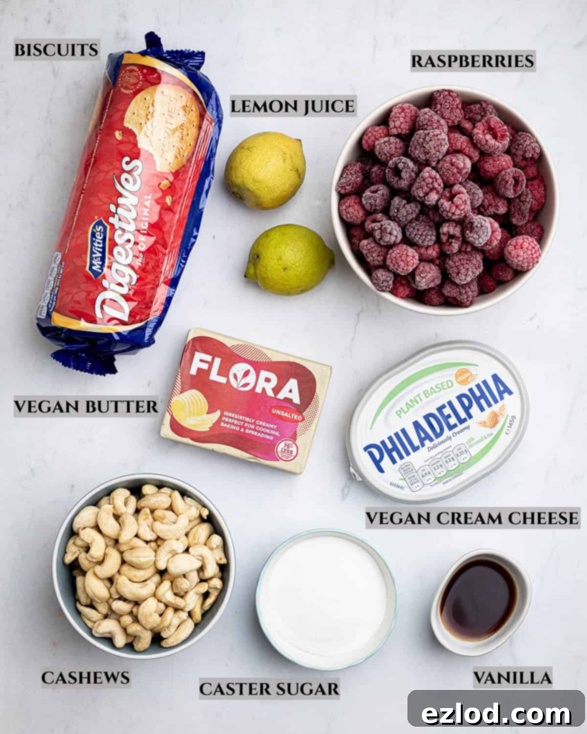 A visually appealing labelled photo showcasing all the essential ingredients meticulously laid out for preparing the exquisite vegan raspberry cheesecake, making it easy to follow.