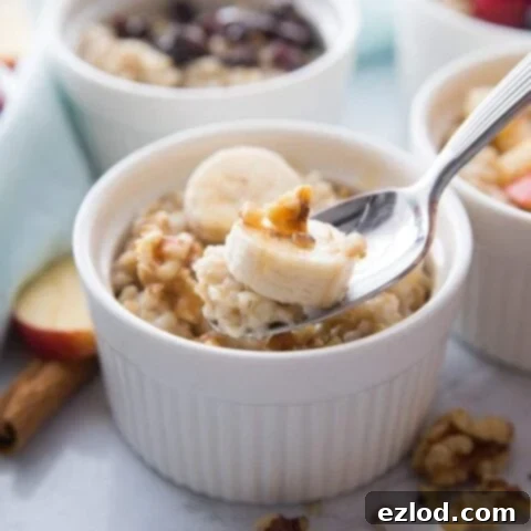 A bowl of steel cut oats with fruit and cinnamon.