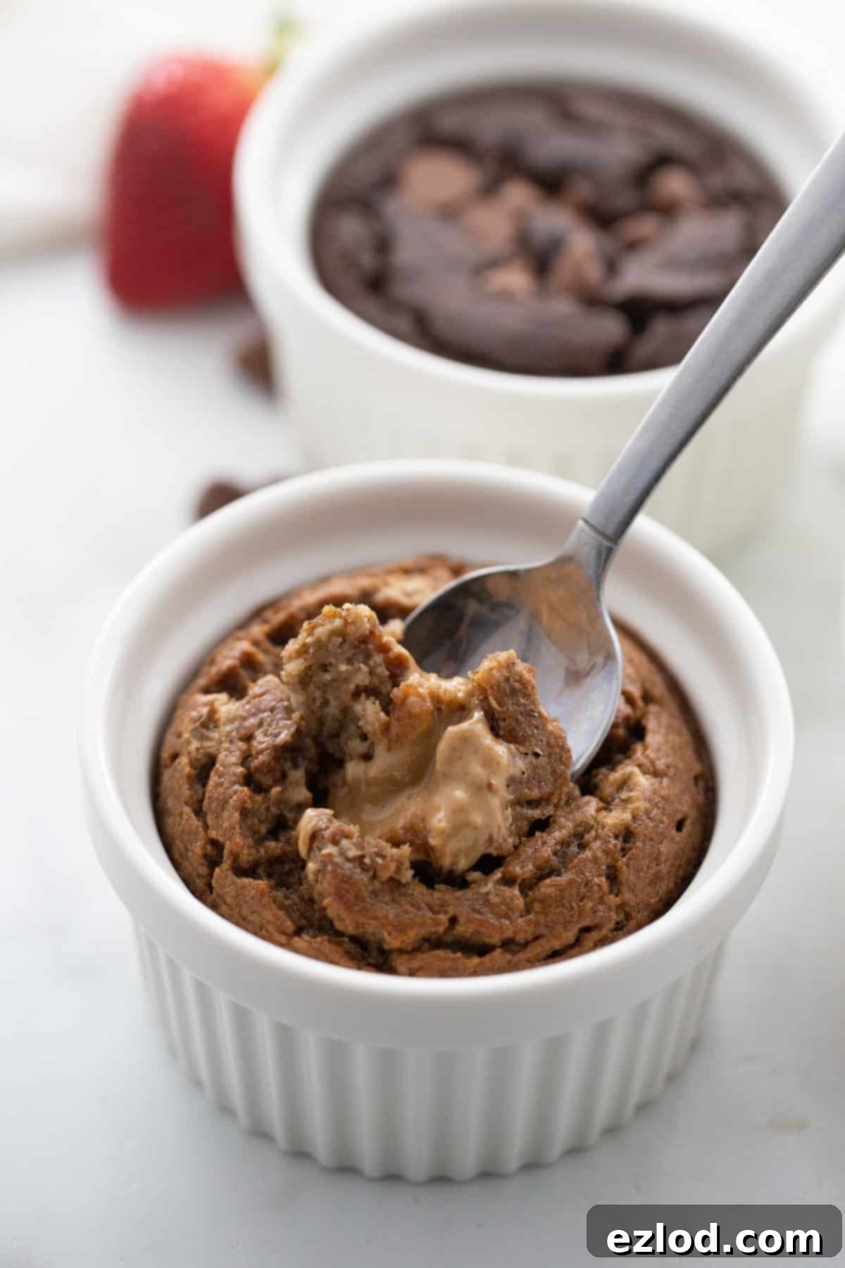 Two ramenkins of blender baked oats: peanut butter baked oats and chocolate baked oats.