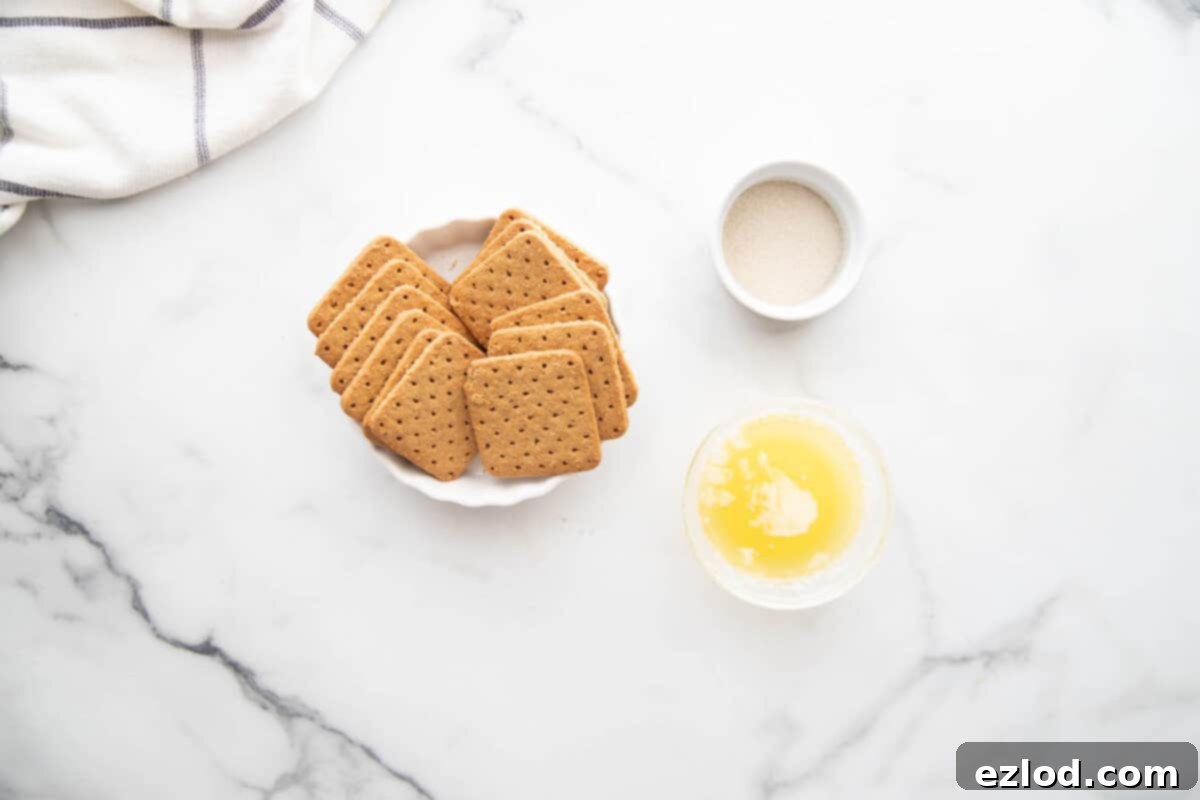 Overhead photo of healthy mini cheesecake crust ingredients on a white countertop.