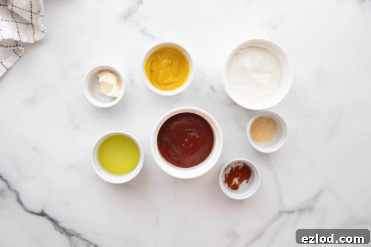 Ingredients for special sauce for burgers made with ketchup, Greek yogurt, mustard, pickle juice, and seasonings.