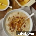 Vanilla amond milk porridge with honey roast pear, cinnamon and hazelnuts. Dairy free and easily adaptable to be vegan.