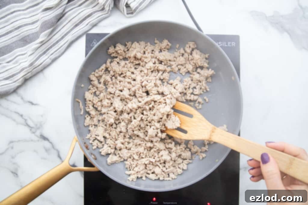 Pan of cooked ground chicken.