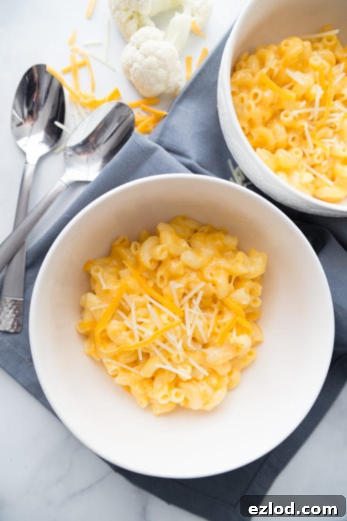 A vibrant, close-up image of the healthy Instant Pot Mac and Cheese, showcasing the perfectly cooked pasta and rich, creamy sauce.