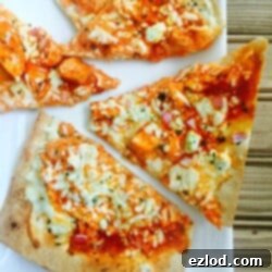 A top-down view of the prepared Buffalo Chicken Pizza, showing the melted cheese and chicken toppings.