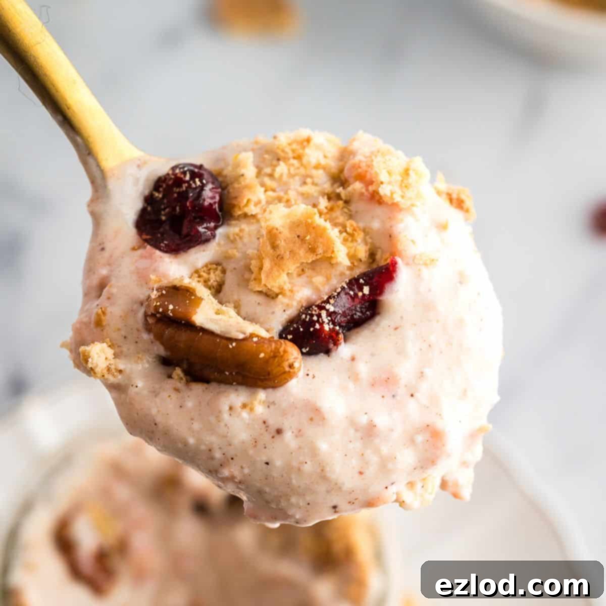 Carrot cake cheesecake cups with crumbled graham crackers and raisins on top.