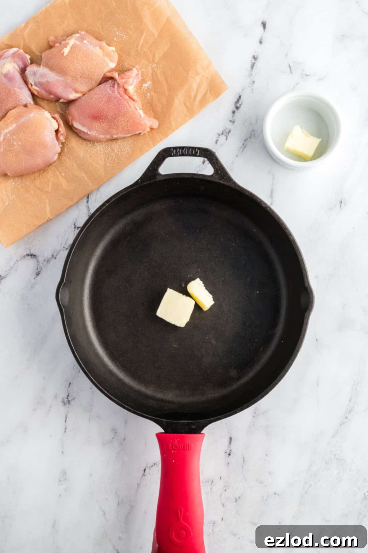 Your Go To One Pan Chicken Orzo 5 Butter melting in a large skillet over medium heat.
