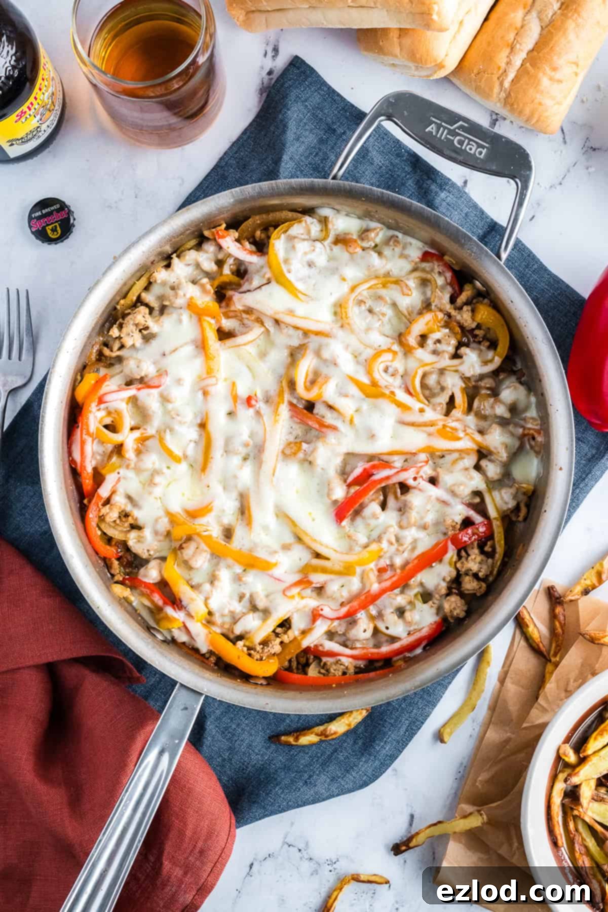 Finished chicken cheesesteak skillet with perfectly melted cheese, ready to be served hot.