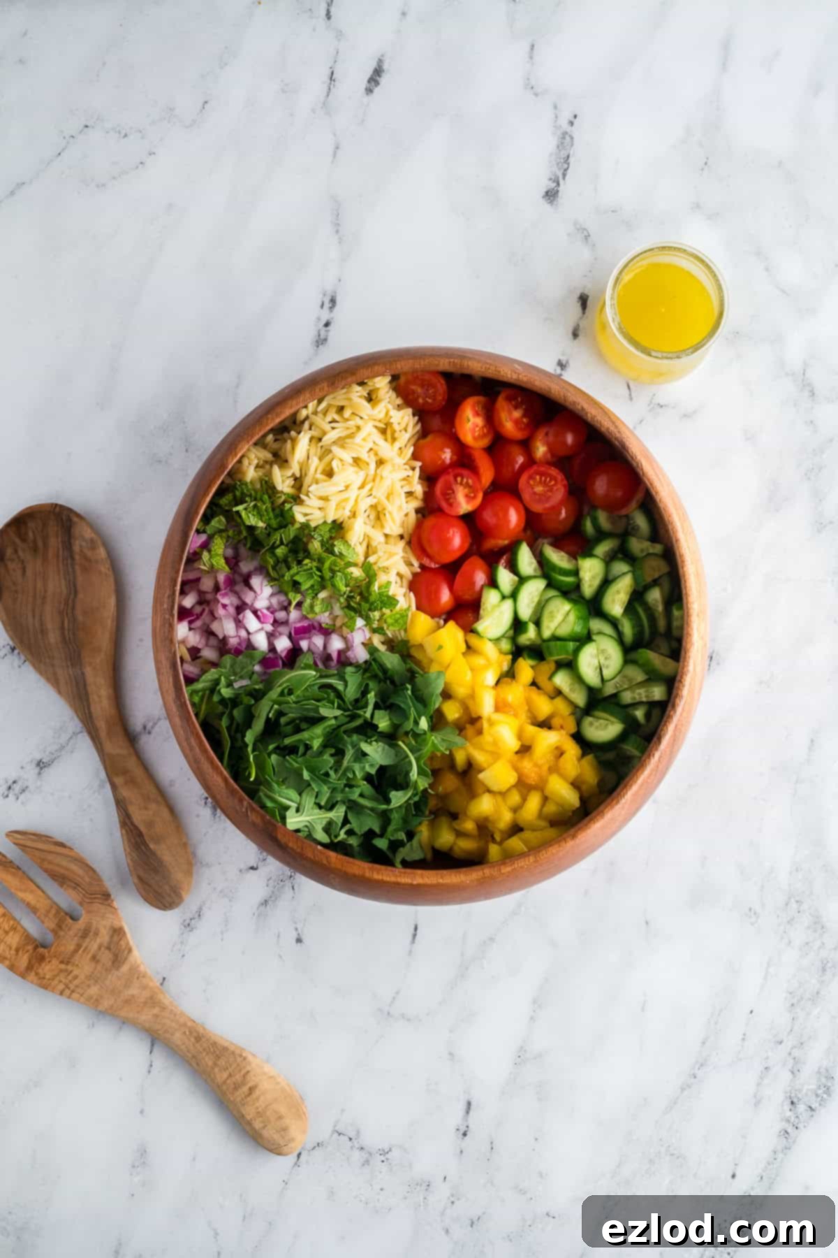 Ingredient in a bowl for summer orzo salad.