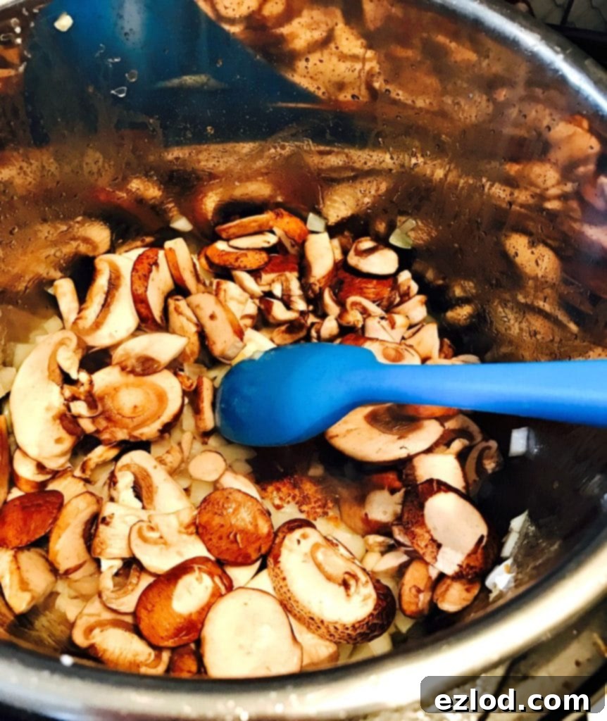 Close-up of creamy, mushroom-filled Instant Pot Chicken Marsala, garnished with fresh parsley.