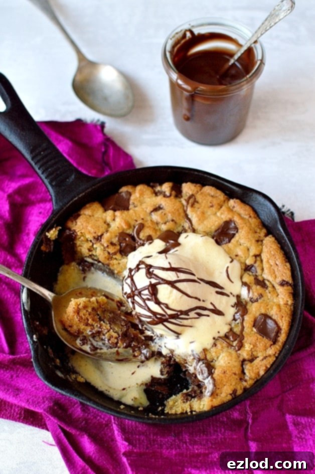 Mouth-watering Nutella stuffed chocolate chunk skillet cookie, ideal for a cozy Valentine's Day treat.