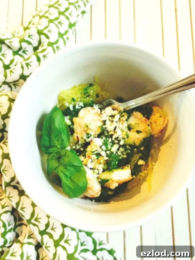 Effortless Spinach Pesto 4 A close-up shot of creamy spinach pesto in a mason jar, showcasing its delicious texture.
