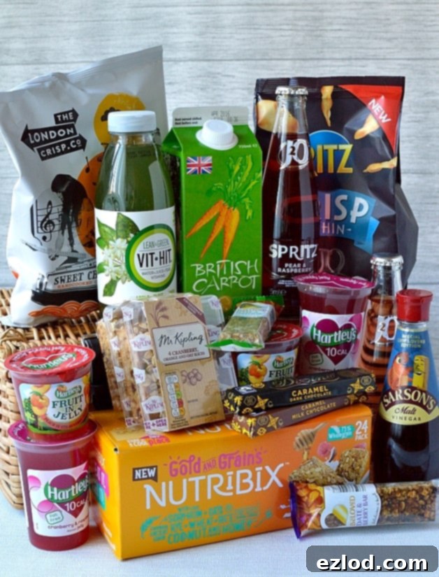 An assortment of all the food and drink products included in the February 2016 Degustabox, neatly arranged for review.