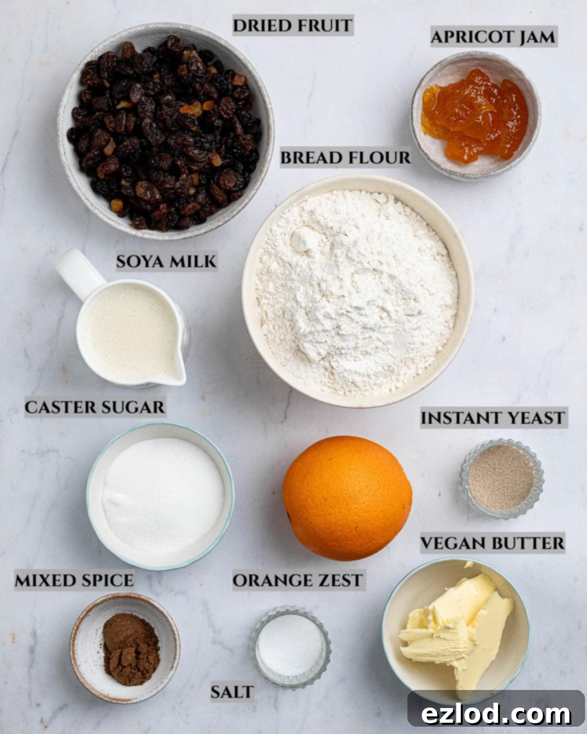 A labelled photo of the ingredients needed to make hot cross bun loaf.