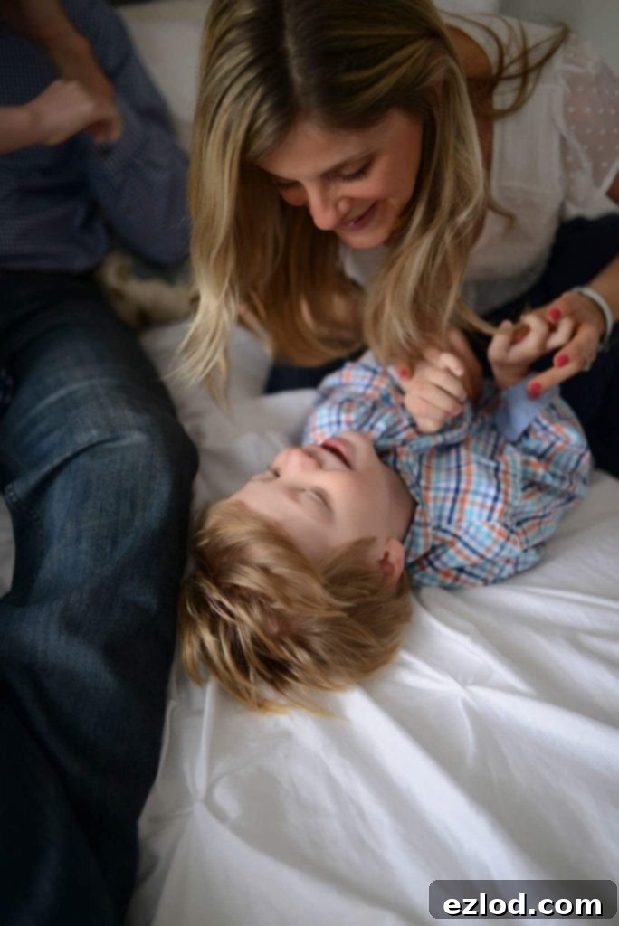 A mother lovingly holding her son, Max, who has Autism, a candid moment of family connection.