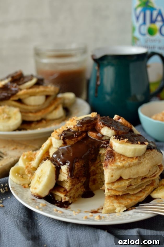 Fluffy toasted coconut pancakes with coconut milk chocolate fudge sauce (dairy-free)