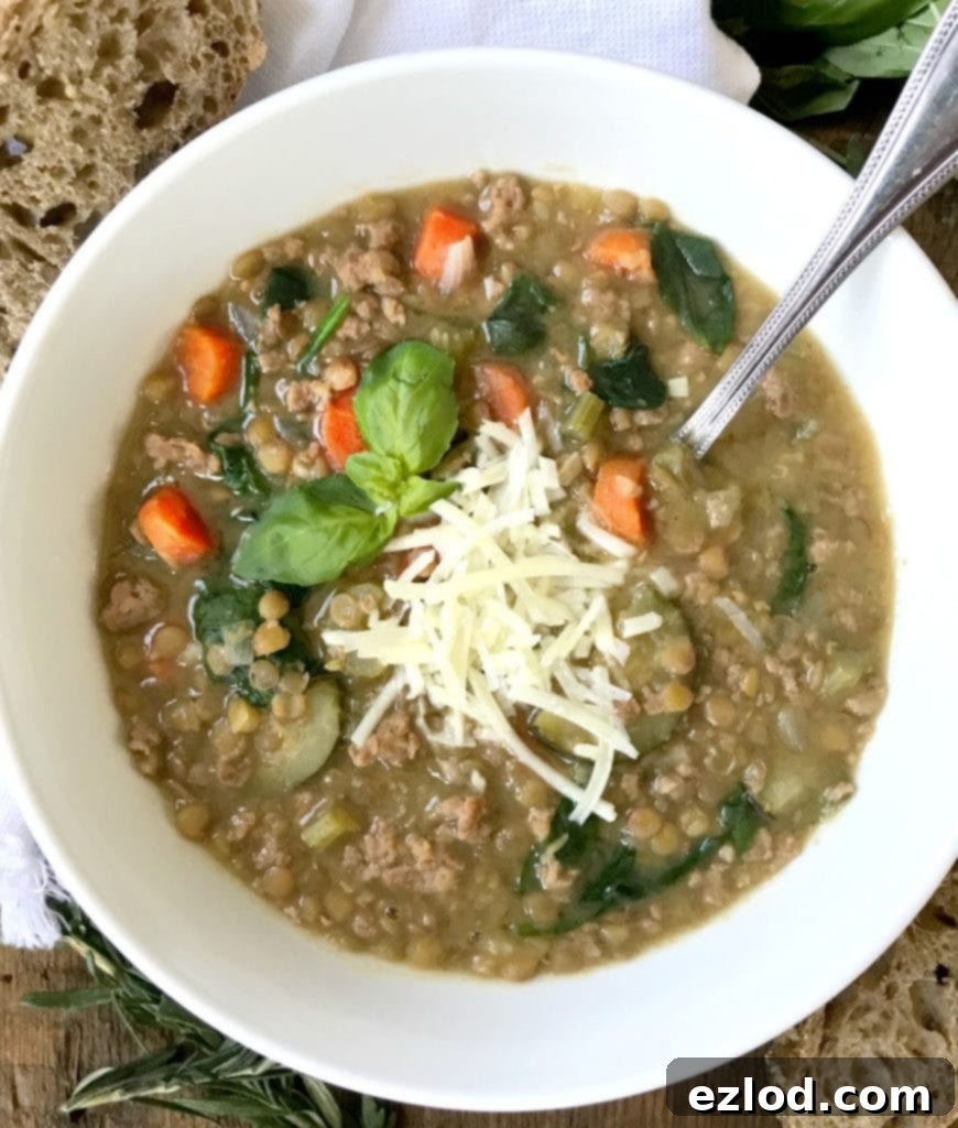 Instant Pot Lentil Soup Confessions of a Fit Foodie | 21 Day Fix Lentil Soup, served in a rustic bowl with a spoon.