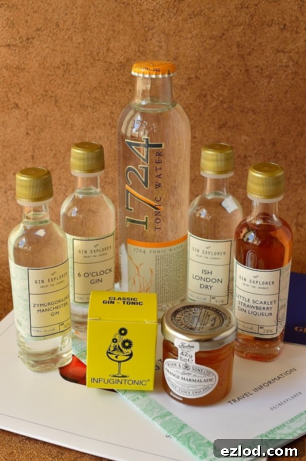 Gin Explorer subscription box contents, featuring various gin samples and botanicals