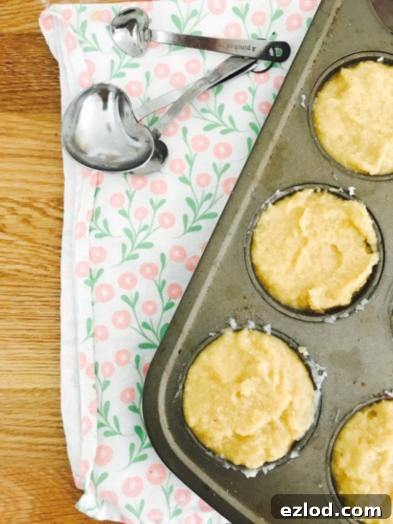Filled muffin tins, ready for the oven