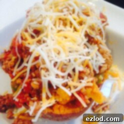 Close-up of a Sloppy Joe Stuffed Sweet Potato, showing the hearty filling and soft potato interior