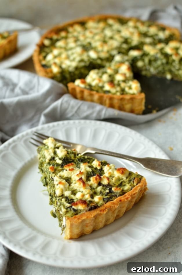 A vibrant Spinach, Ricotta, and Feta Quiche, freshly baked and set on a cooling rack, adorned with a final sprinkle of herbs.