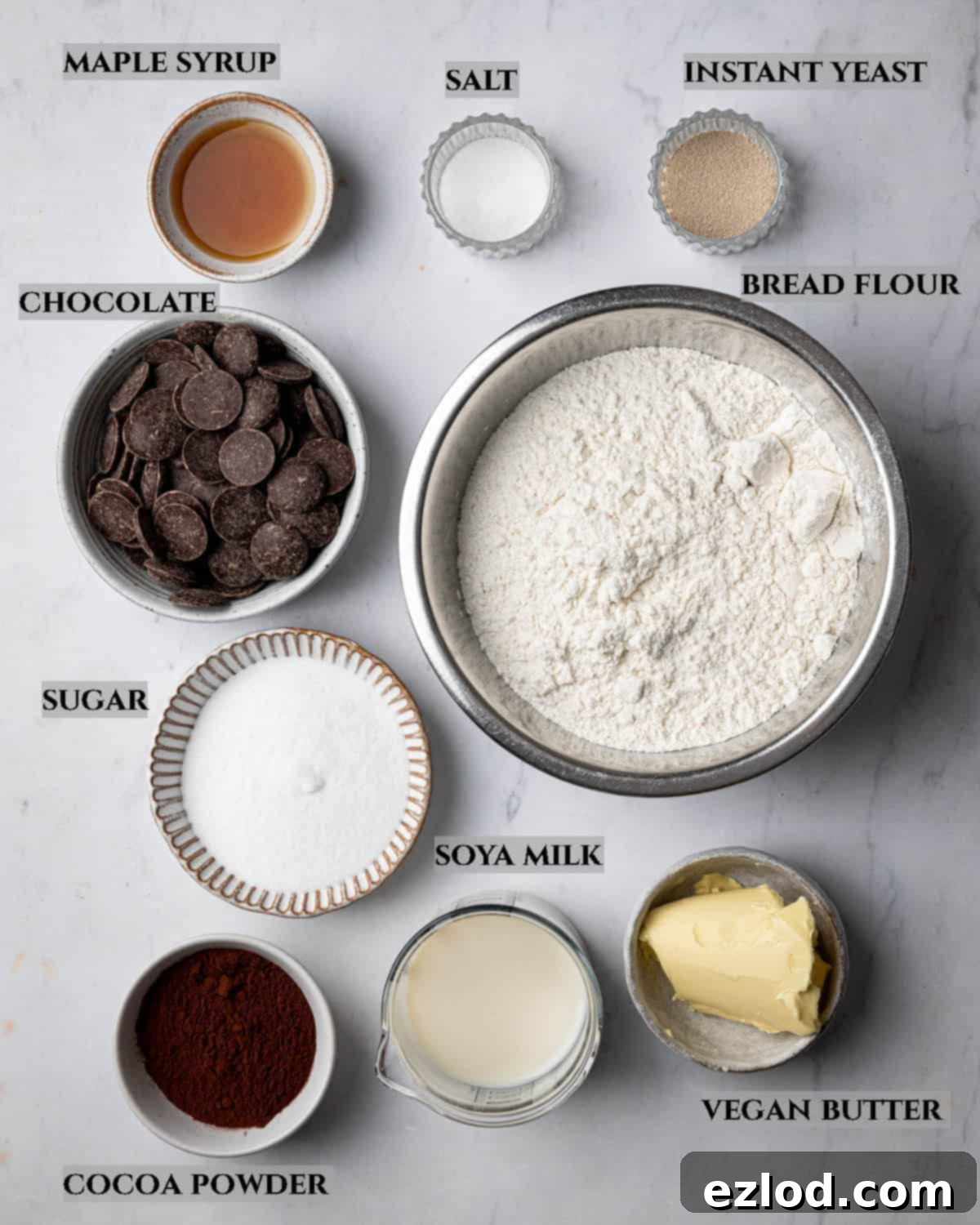 A labelled photo of the ingredients needed to make chocolate swirl buns in bowls.