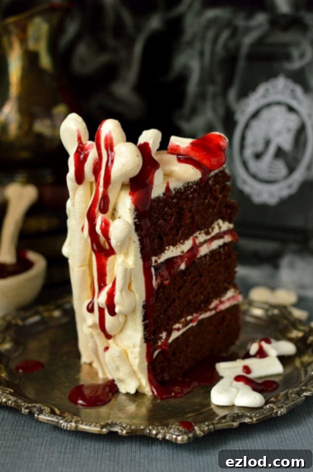 Close-up of the Meringue Bone Palace Halloween Cake, showcasing the detailed meringue bones and layers of rich chocolate cake and vanilla Swiss meringue buttercream filling