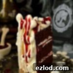 Spooky meringue bone palace Halloween cake - moist chocolate cake with vanilla Swiss meringue buttercream, raspberry jam, meringue bones and berry coulis 'blood'