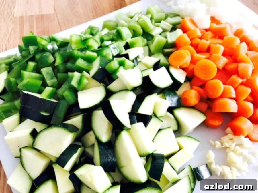 Chopped veggies on a white cutting board